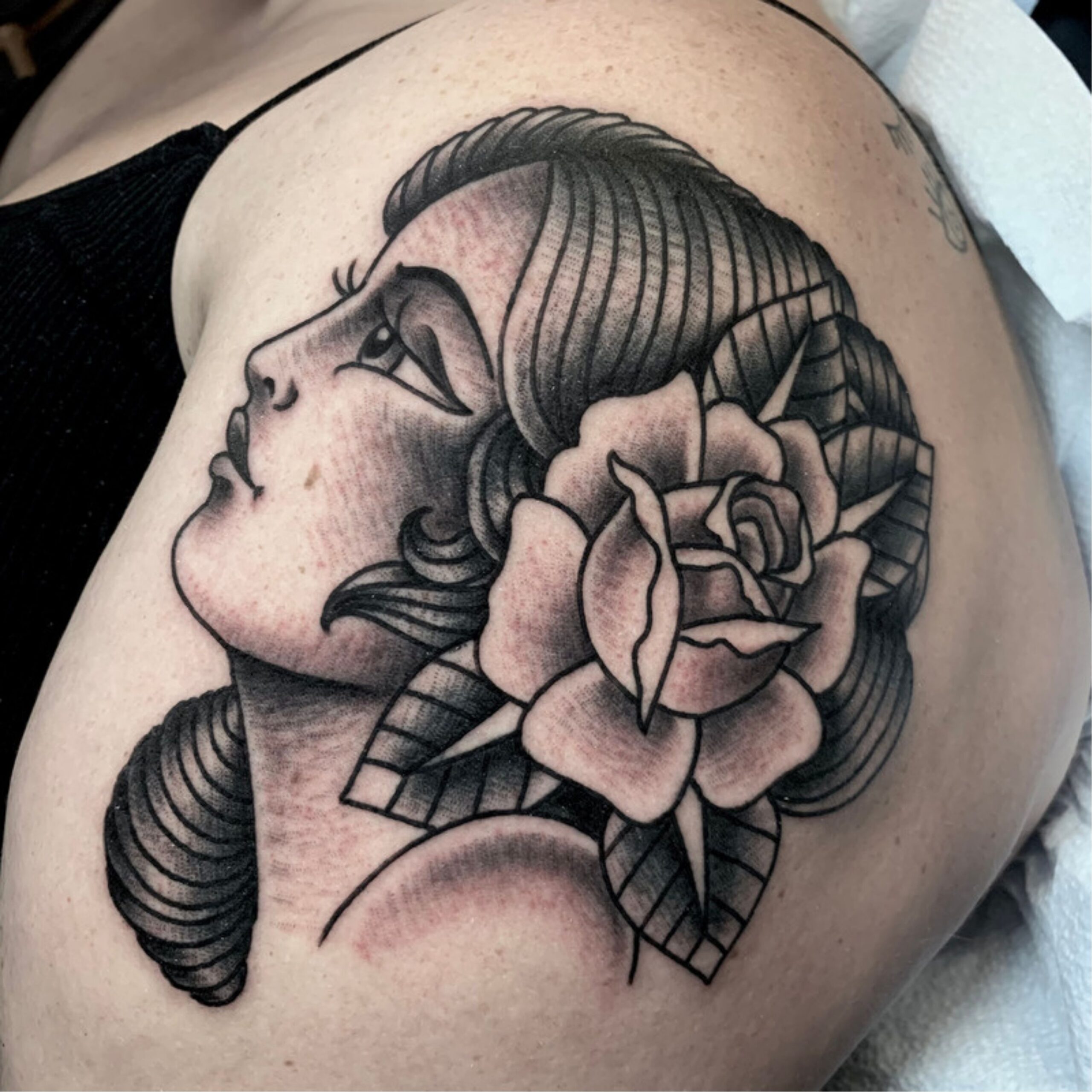 Black and Grey Traditional Lady Head Tattoo by Tom Veling at Small World Tattoo, the best tattoo shops near me.